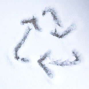 recycling symbol drawn in snow