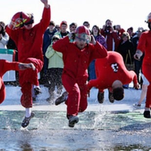 group participating in the Polar Plunge in red jumpsuits