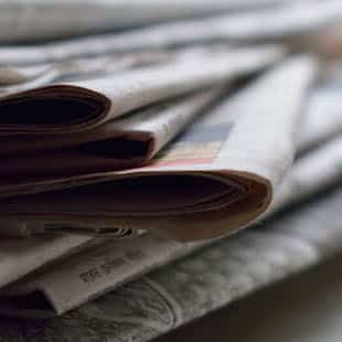 stack of folded newspaper