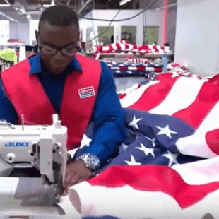 MDI employee sewing American flag