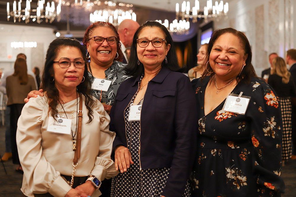 Attendees smile at the MDI Ability Bash fundraiser.