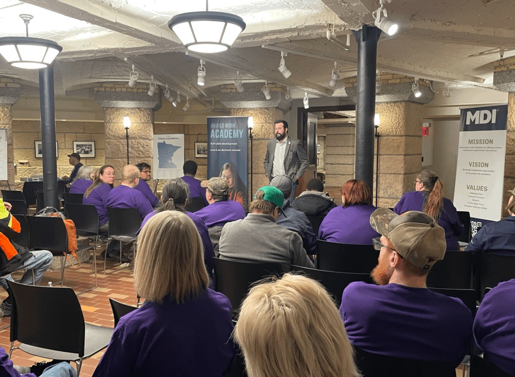 Representative Spencer Igo speaks with MDI employees