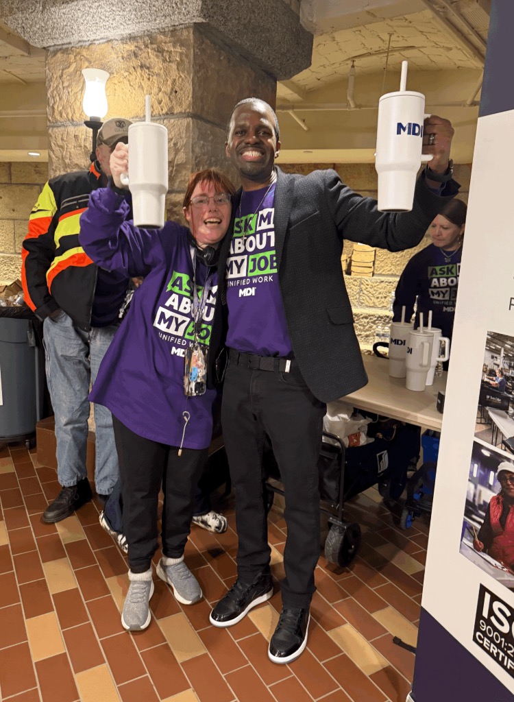 Eric Black stands with MDI employee at MN State Capital
